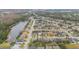 Aerial view of the neighborhood featuring a lake and lush greenery at 10068 Chardonnay Dr, Orlando, FL 32832