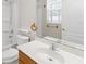 Bathroom featuring a single sink vanity, toilet, and a shower-tub combo at 10068 Chardonnay Dr, Orlando, FL 32832