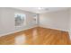 Spacious bedroom features hardwood floors and natural light from the two large windows at 10068 Chardonnay Dr, Orlando, FL 32832