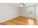 Inviting bedroom with hardwood floors and a pleasant view from the window at 10068 Chardonnay Dr, Orlando, FL 32832