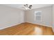 Cozy bedroom with hardwood floors and a window for natural light and ventilation at 10068 Chardonnay Dr, Orlando, FL 32832