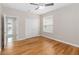 Bedroom with wood floors, ceiling fan and closet at 10068 Chardonnay Dr, Orlando, FL 32832