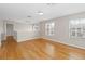 Bright bonus room with gleaming hardwood floors and a view of the neighborhood at 10068 Chardonnay Dr, Orlando, FL 32832