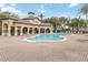 Inviting community pool area with ample seating and shaded lounging spaces, perfect for relaxation at 10068 Chardonnay Dr, Orlando, FL 32832