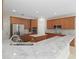 Modern kitchen with stainless steel appliances and marble countertops at 10068 Chardonnay Dr, Orlando, FL 32832