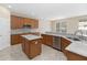 Well-equipped kitchen with modern appliances, marble counter tops and island at 10068 Chardonnay Dr, Orlando, FL 32832
