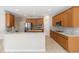 Modern kitchen with stainless steel appliances and marble countertops at 10068 Chardonnay Dr, Orlando, FL 32832