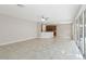Open living room featuring tile floors with adjoined access to the kitchen at 10068 Chardonnay Dr, Orlando, FL 32832