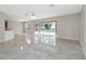 Spacious living room with tile floors and sliding glass doors to the pool at 10068 Chardonnay Dr, Orlando, FL 32832