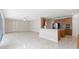 Open living room featuring tile floors with adjoined access to the kitchen at 10068 Chardonnay Dr, Orlando, FL 32832