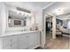 Bathroom showcasing a marble vanity with a large mirror and lighting at 1150 Carmel Cir # 503, Casselberry, FL 32707