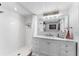 Bathroom featuring a walk-in shower and marble vanity with ample storage space at 1150 Carmel Cir # 503, Casselberry, FL 32707