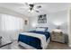 Comfortable bedroom with white walls, wood-look tile flooring, and a ceiling fan at 1150 Carmel Cir # 503, Casselberry, FL 32707