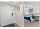 Inviting bedroom entrance with wood-look flooring, ceiling fan and view into the room at 1150 Carmel Cir # 503, Casselberry, FL 32707