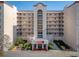 Attractive multi-story condominium with balconies and manicured landscaping at entrance at 1150 Carmel Cir # 503, Casselberry, FL 32707