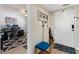 Entryway with a blue accent stool and an adjacent office space, offering a functional welcome at 1150 Carmel Cir # 503, Casselberry, FL 32707
