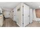 Hallway view showcasing access to multiple rooms and featuring wood-look tile flooring at 1150 Carmel Cir # 503, Casselberry, FL 32707