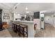 Bright kitchen featuring a breakfast bar with seating, stainless steel appliances, and stylish backsplash at 1150 Carmel Cir # 503, Casselberry, FL 32707