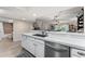 Kitchen with stainless steel dishwasher and views to bathroom and living area at 1150 Carmel Cir # 503, Casselberry, FL 32707