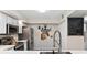 Close-up of kitchen featuring stainless steel appliances and decorative backsplash at 1150 Carmel Cir # 503, Casselberry, FL 32707