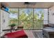 Screened lanai featuring comfortable seating and lush green views at 1150 Carmel Cir # 503, Casselberry, FL 32707