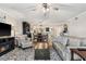 Cozy living room with wood floors and comfortable seating, opening to the dining area at 1150 Carmel Cir # 503, Casselberry, FL 32707