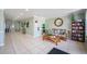 Inviting building lobby with seating area and bookshelf filled with reading material at 1150 Carmel Cir # 503, Casselberry, FL 32707