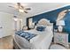 Inviting bedroom features stylish decor, with accent pillows and side tables with lamps at 1150 Carmel Cir # 503, Casselberry, FL 32707