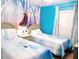 Charming bedroom featuring twin beds and a delightful theme at 1217 Cypress Pointe Blvd, Davenport, FL 33896