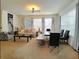 Comfortable living room with a sofa, coffee table, and a dining area with seating at 1217 Cypress Pointe Blvd, Davenport, FL 33896