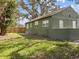 The spacious backyard with lush grass and privacy fence makes it a great place to relax or entertain guests at 130 Mandrake St, Orlando, FL 32811