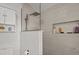 Elegant bathroom with a walk-in shower, featuring tiled walls and recessed shelving at 130 Mandrake St, Orlando, FL 32811