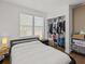 Cozy bedroom with ample closet space, natural light, and comfortable furnishings at 130 Mandrake St, Orlando, FL 32811