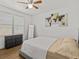 Stylishly appointed bedroom with a neutral color palette, ceiling fan, and ample natural light from the windows at 130 Mandrake St, Orlando, FL 32811