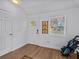 Bright foyer with wood floors, and a view through the front door at 130 Mandrake St, Orlando, FL 32811