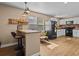 Spacious kitchen with breakfast bar, stainless steel appliances, and plenty of natural light at 130 Mandrake St, Orlando, FL 32811