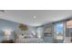 Comfortable main bedroom with soft lighting, stylish decor, and windows providing natural light at 1327 Fan Palm Dr, Davenport, FL 33897