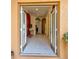 Inviting foyer with tile flooring, arched doorways, and natural light streaming through the glass double-door entry at 13318 Kitty Fork Rd, Orlando, FL 32828