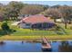 Aerial view of home with private dock on the water at 13509 Lake Luntz Dr, Winter Garden, FL 34787