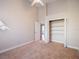 Bedroom featuring carpet, ceiling fan, closet, and neutral paint at 13509 Lake Luntz Dr, Winter Garden, FL 34787