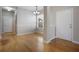 Dining room features wood flooring, a window, and a white entrance door at 15319 Oak Apple Ct, Winter Garden, FL 34787