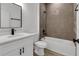 Modern bathroom featuring a sleek vanity, black fixtures, and tiled shower and tub at 15657 Sw 37Th Cir, Ocala, FL 34473
