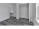 Bright bedroom featuring luxury vinyl plank flooring, closet, white trim and white doors at 15657 Sw 37Th Cir, Ocala, FL 34473