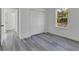 Bedroom with luxury vinyl plank flooring, a double closet, and large window at 15657 Sw 37Th Cir, Ocala, FL 34473