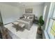 Cozy main bedroom featuring a large bed, neutral decor, and ample natural light from the window at 15657 Sw 37Th Cir, Ocala, FL 34473
