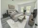 Well-lit main bedroom featuring neutral decor, luxury flooring and large windows for natural light at 15657 Sw 37Th Cir, Ocala, FL 34473