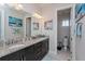 Bathroom with granite counter tops, double vanity and a separate toilet room at 15732 Shorebird Ln, Winter Garden, FL 34787