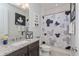 Bathroom with granite counter tops, under-mounted sink, toilet and shower with tub at 15732 Shorebird Ln, Winter Garden, FL 34787