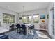 Bright dining area with lots of natural light, a built-in desk, and a modern light fixture at 15732 Shorebird Ln, Winter Garden, FL 34787