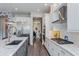 Well-appointed kitchen with modern appliances, ample counter space, and stylish white cabinetry at 15732 Shorebird Ln, Winter Garden, FL 34787